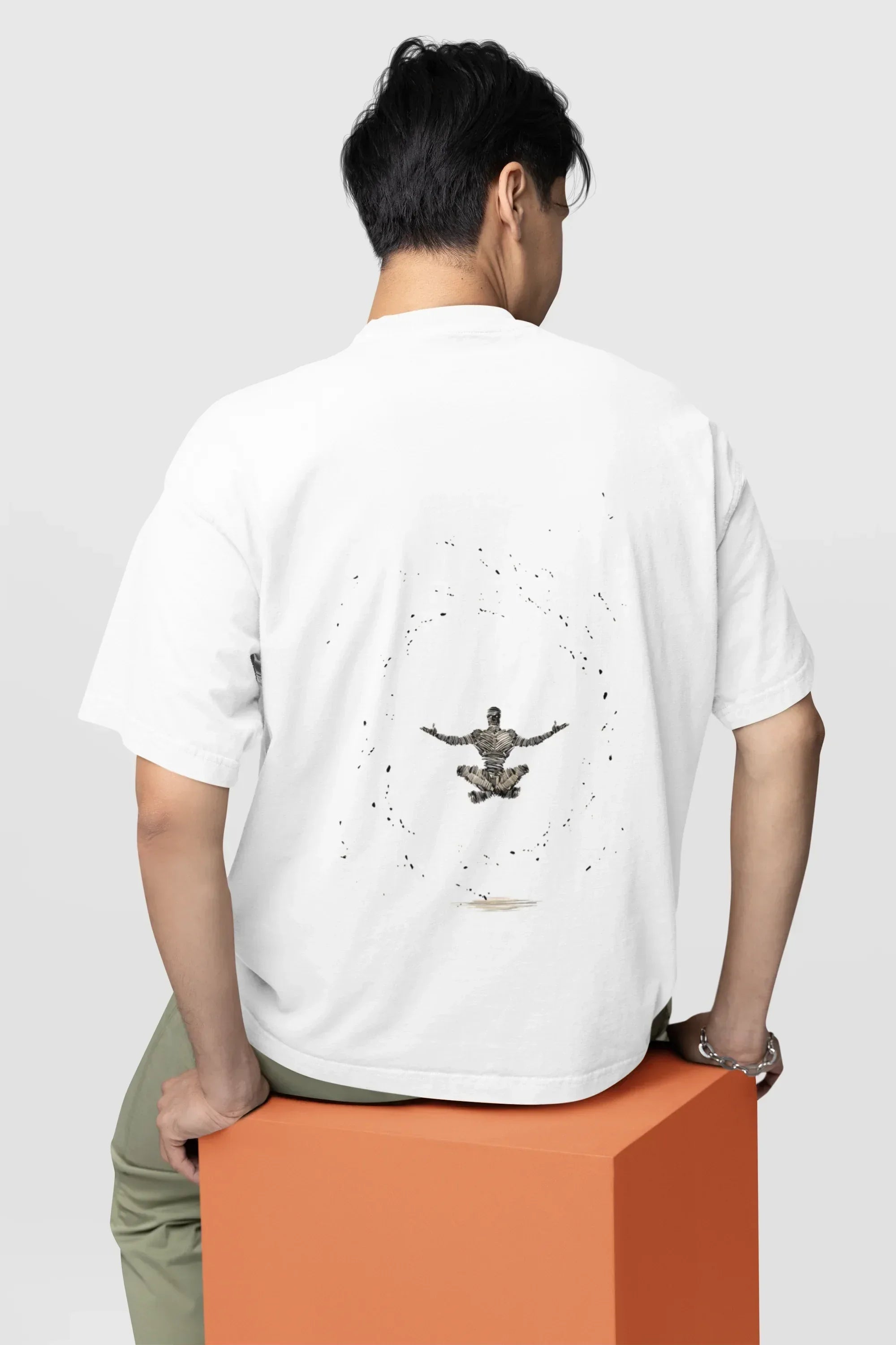 back-view-oversized-tee-mockup-of-a-man-sitting-on-a-customizable-cube-m38922_1 - Drippyx
