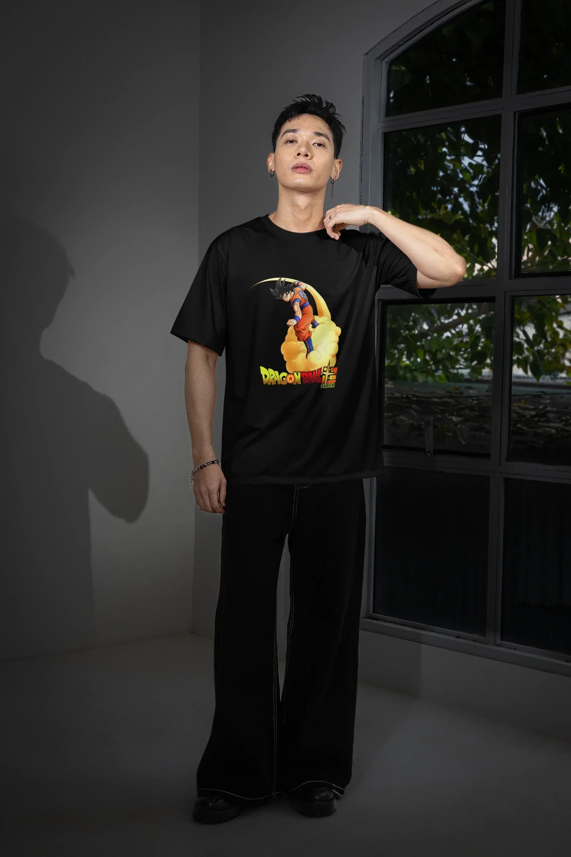 mockup-of-a-man-posing-near-a-window-while-wearing-an-oversized-t-shirt-m54149_2 - Drippyx