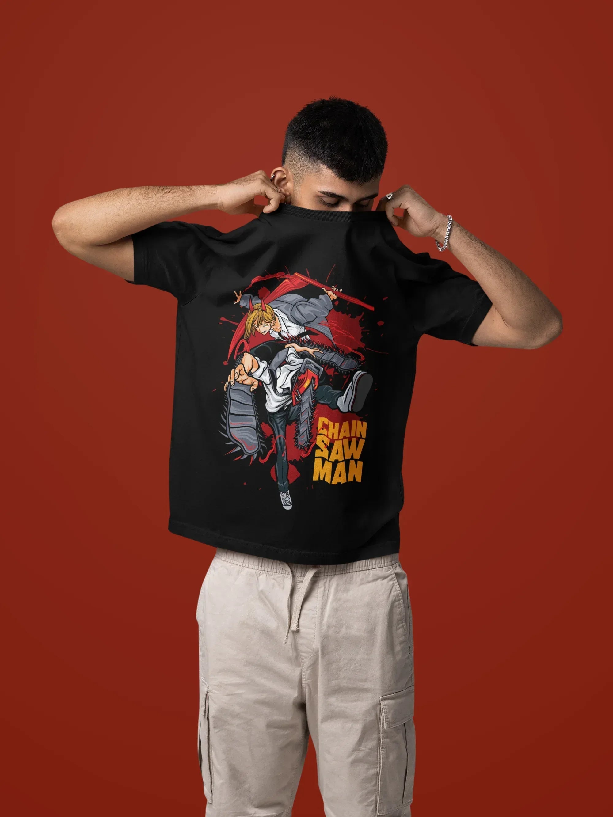 mockup-of-a-man-taking-off-his-oversized-t-shirt-in-a-studio-setting-m57443_1 - Drippyx