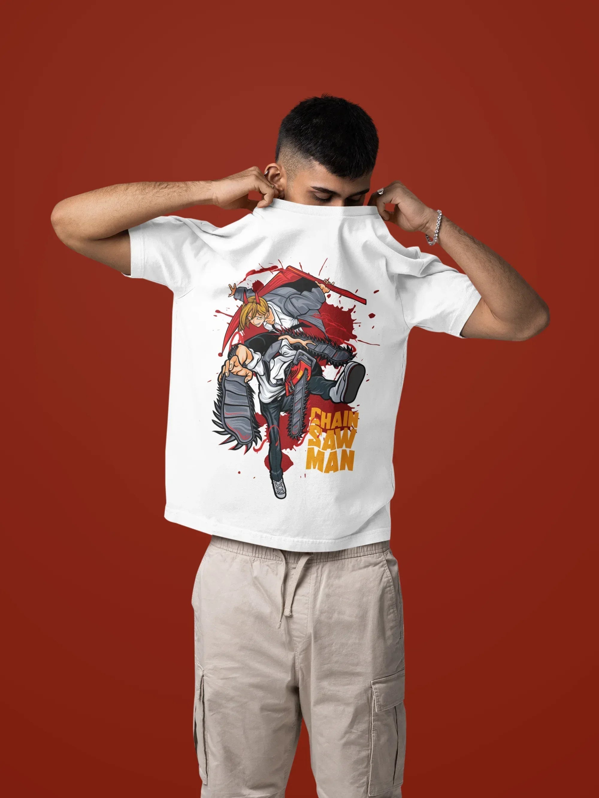 mockup-of-a-man-taking-off-his-oversized-t-shirt-in-a-studio-setting-m57443_2 - Drippyx