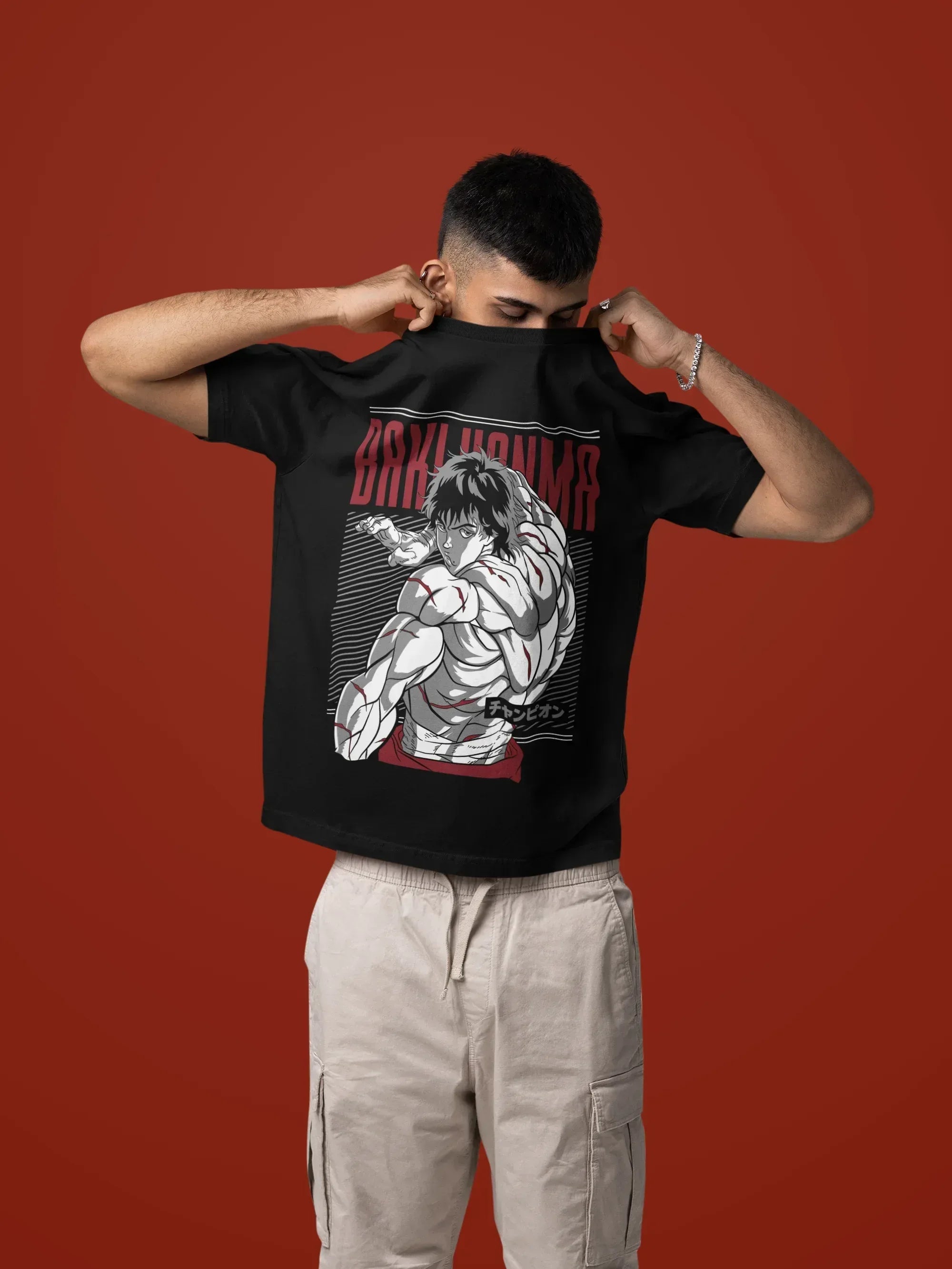 mockup-of-a-man-taking-off-his-oversized-t-shirt-in-a-studio-setting-m57443_3 - Drippyx