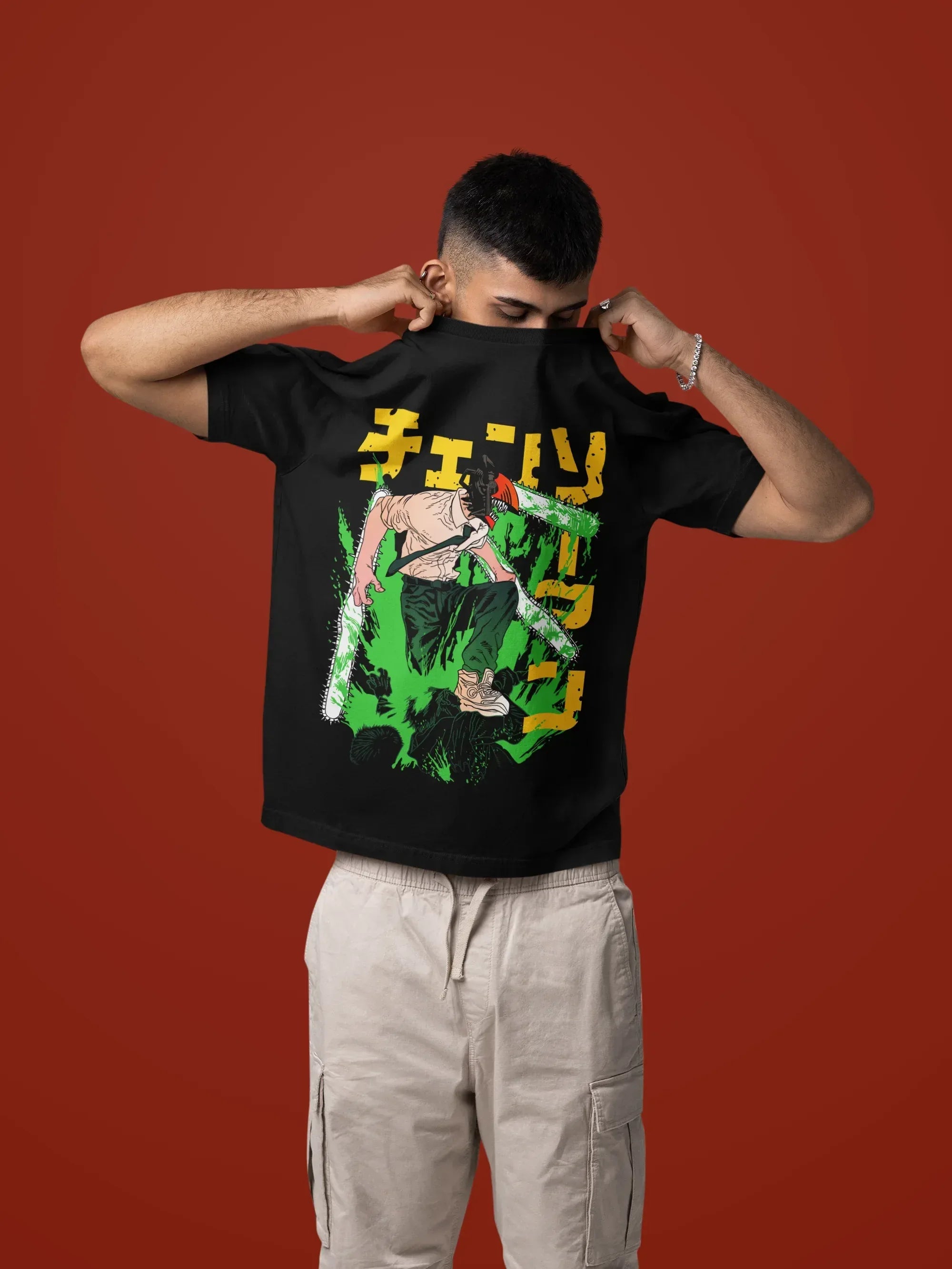 mockup-of-a-man-taking-off-his-oversized-t-shirt-in-a-studio-setting-m57443_4 - Drippyx