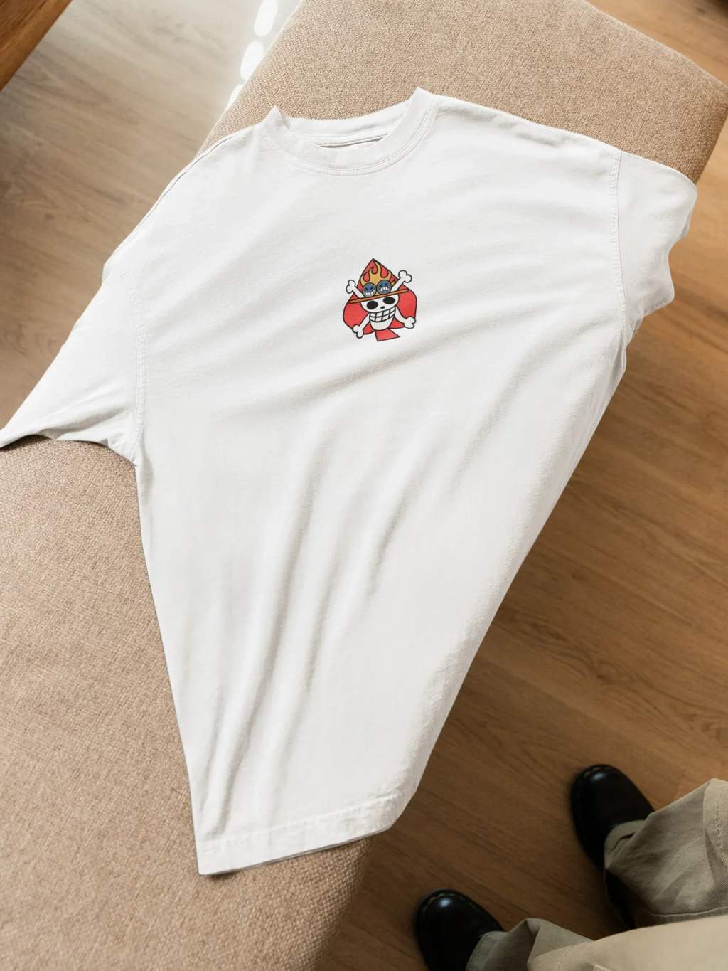 mockup-of-an-oversized-t-shirt-lying-on-a-couch-featuring-a-man-m52020 - Drippyx