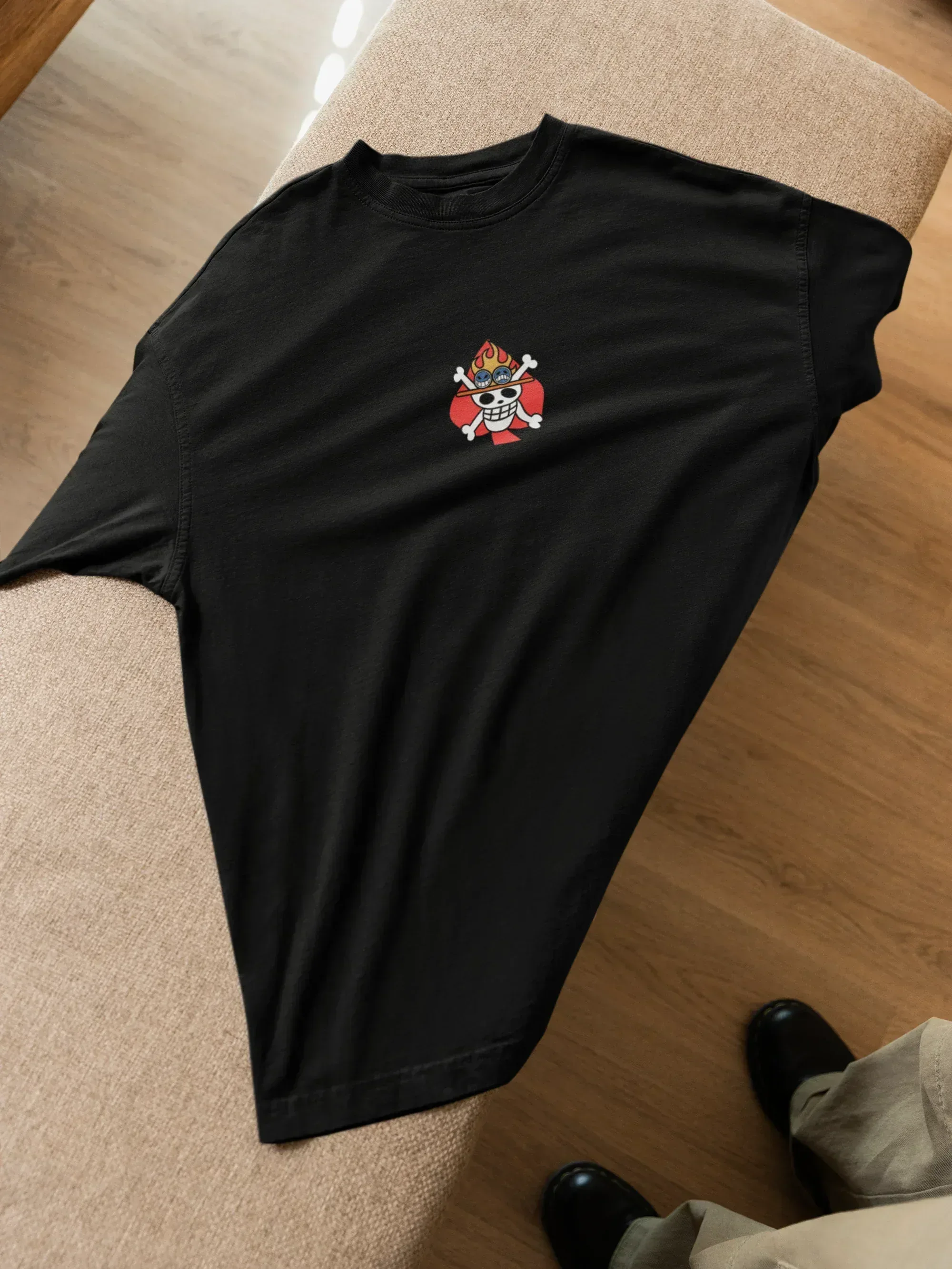 mockup-of-an-oversized-t-shirt-lying-on-a-couch-featuring-a-man-m52020_1 - Drippyx