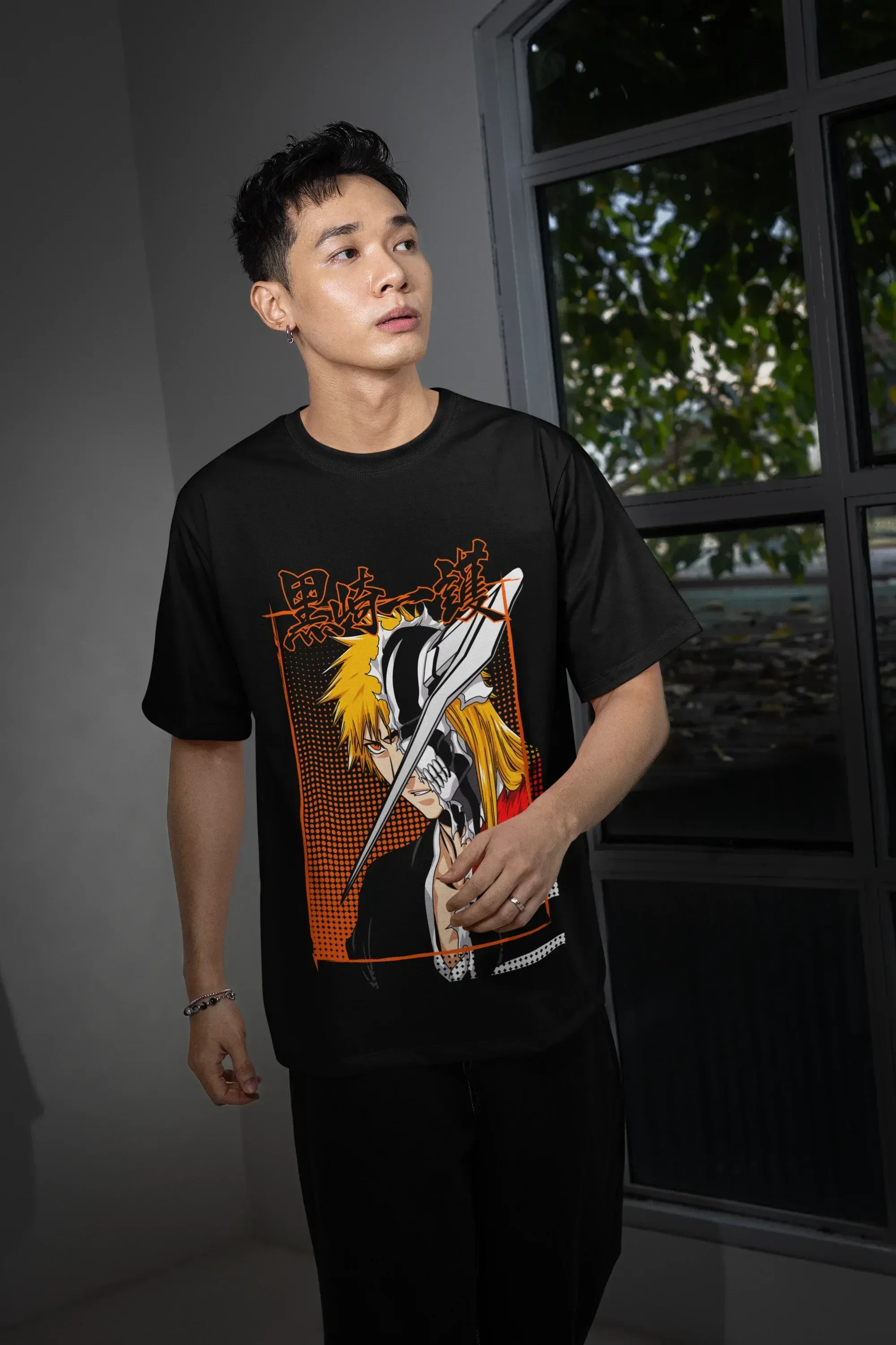 oversized-t-shirt-mockup-featuring-a-man-posing-with-a-serious-look-and-standing-near-a-window-m54148_1 - Drippyx