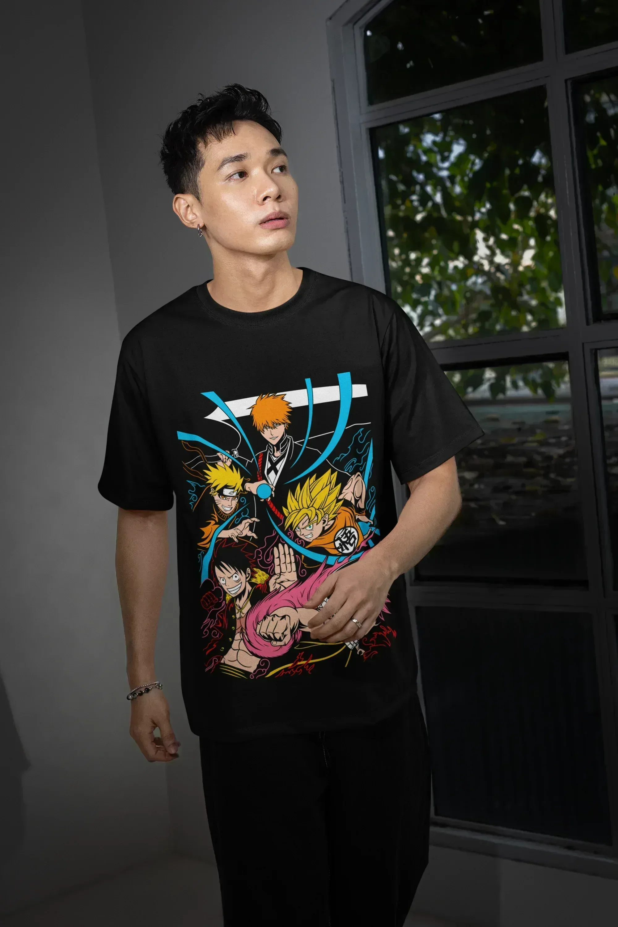 oversized-t-shirt-mockup-featuring-a-man-posing-with-a-serious-look-and-standing-near-a-window-m54148_4 - Drippyx