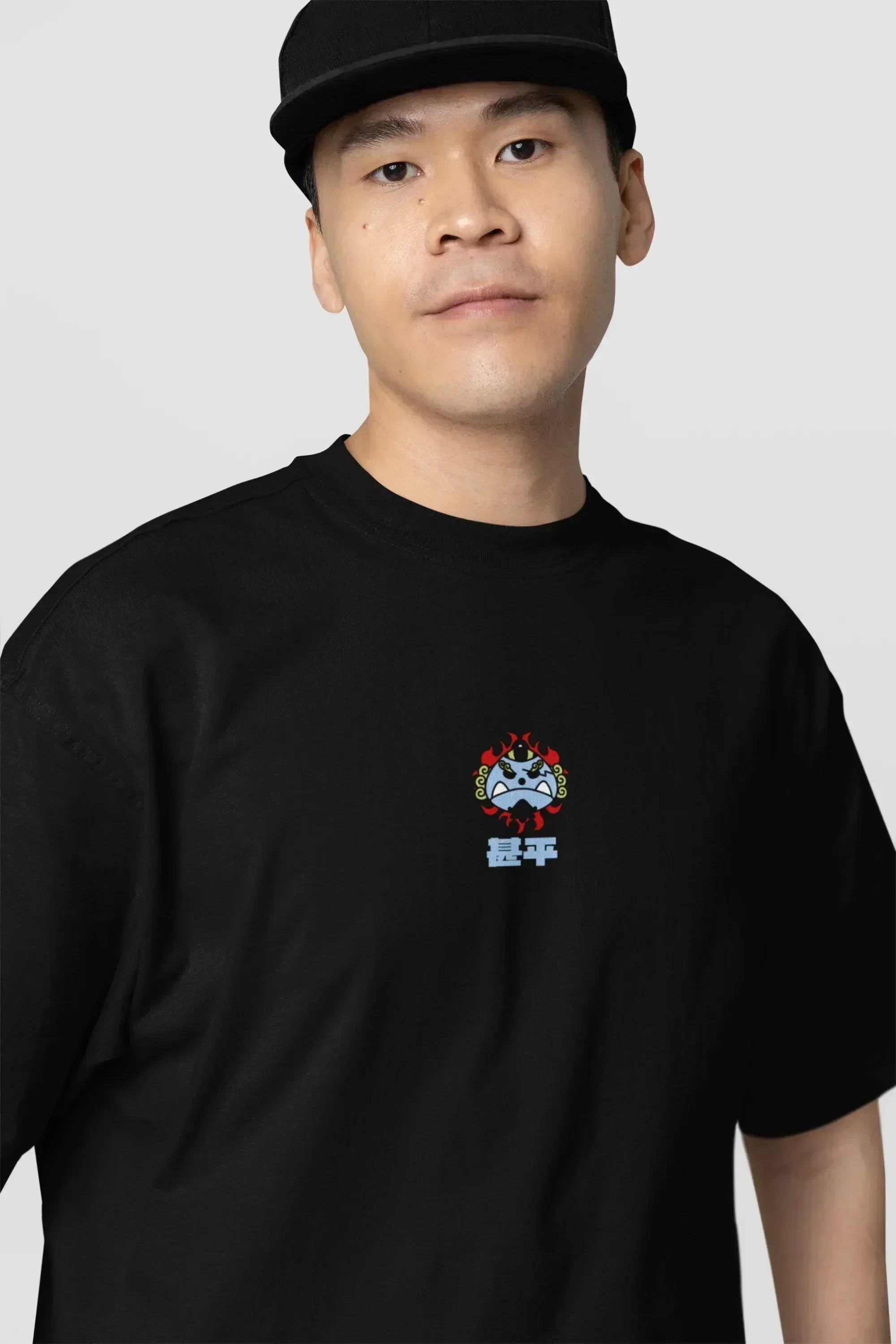 oversized-tee-mockup-of-a-serious-man-standing-against-a-customizable-background-m38927_8 - Drippyx